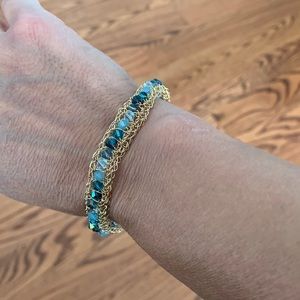 Gold bracelet with blue stones